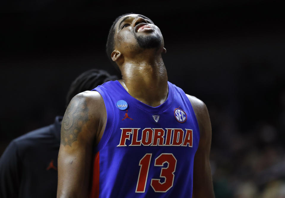 Florida center Kevarrius Hayes walks off the court after a second round men's college basketball game against Michigan in the NCAA Tournament, Saturday, March 23, 2019, in Des Moines, Iowa. Michigan won 64-49. (AP Photo/Charlie Neibergall)