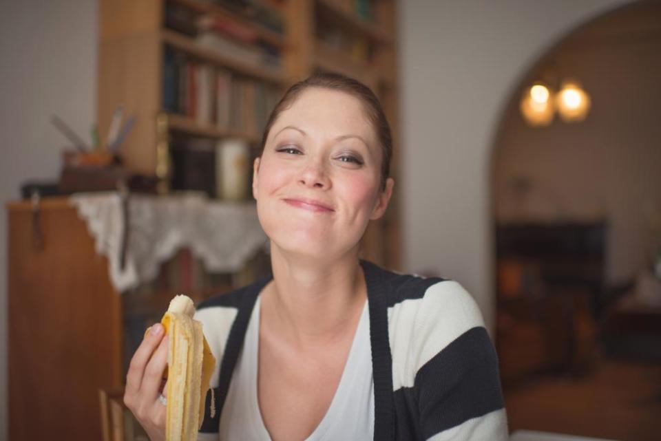 Woman eating a banana