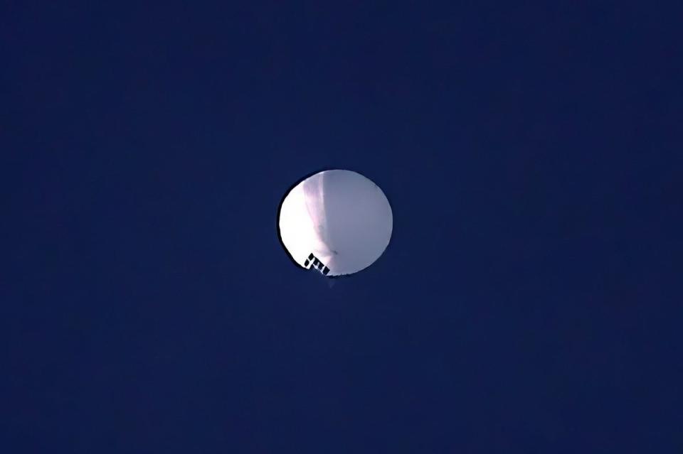 A high altitude balloon was shot out of the sky by an F-22 jet after travelling across the US for several days (AP)