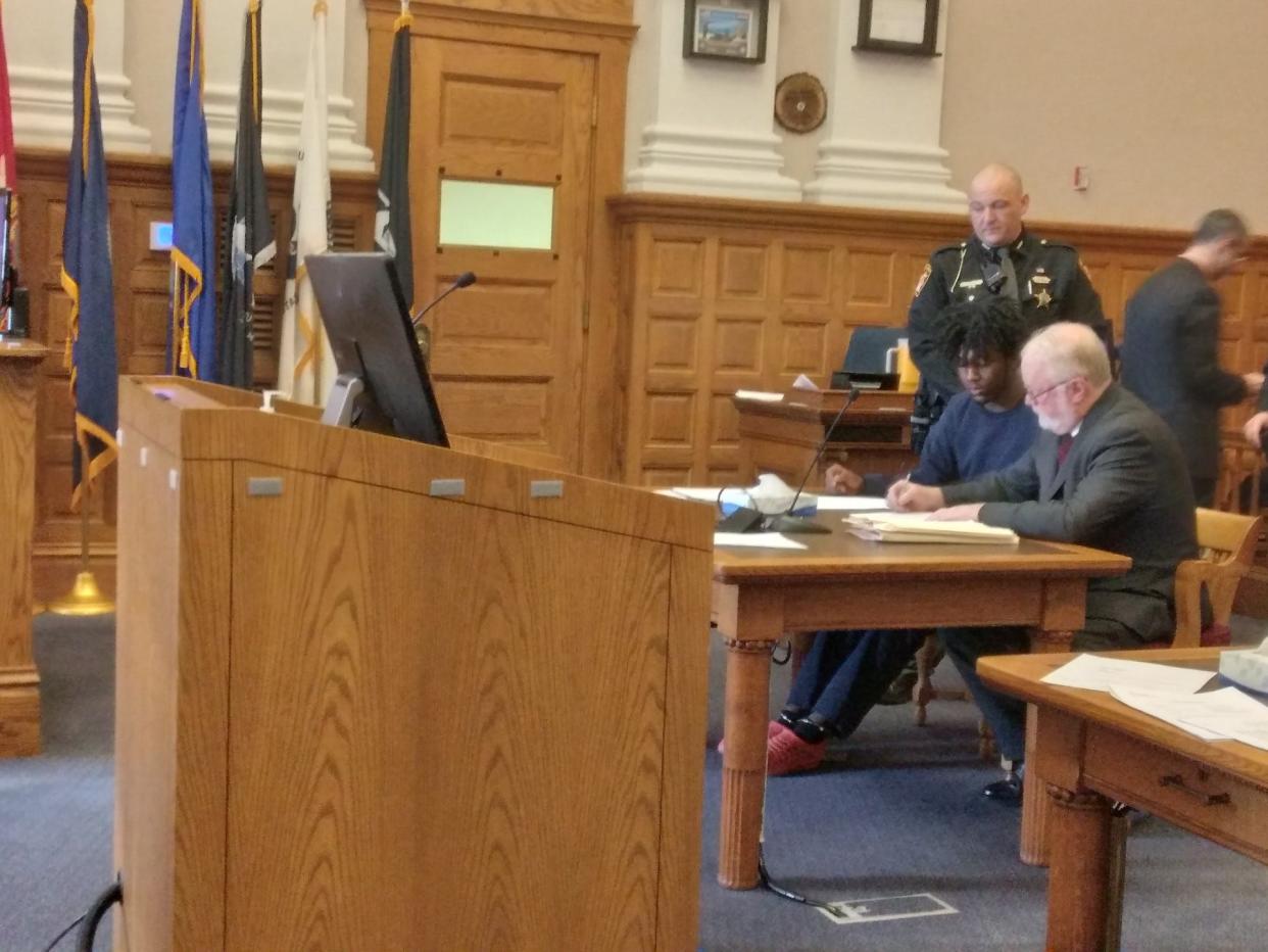 Anton J. Nash is shown seated at left in Stark County Common Pleas Court on Tuesday with his attorney Jeffrey Jakmides. Nash pleaded guilty to two counts of felonious assault in connection with an April 29 shooting at a Sweet 16 party in Canton.