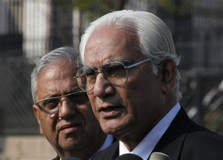 Ahmed Raza Kasuri (R) and Siddiq Mirza, lawyers of former Pakistani president Pervez Musharraf speak to the media outside the Special Court building in Islamabad January 1, 2014. REUTERS/Mian Khursheed