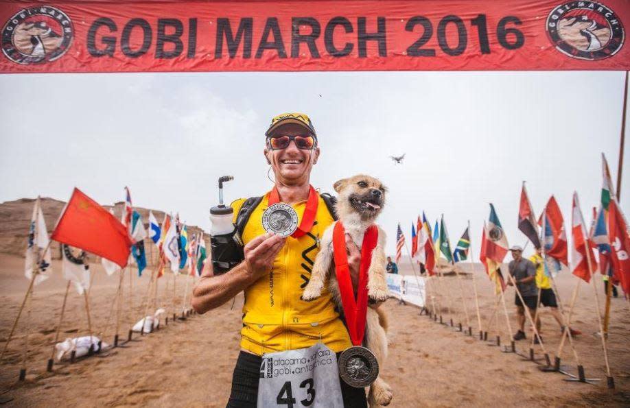 This stray dog ran a 150-mile race and ended up with a new dad