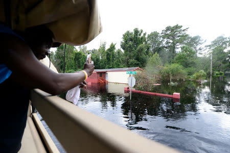 High waters surround homes and businesses in the small town of Bucksport, South Carolina, U.S. as rivers continue to rise and flooded areas expand as a result of Hurricane Florence, September 24, 2018. Staff Sgt. Jorge Intriago/U.S. Army National Guard/Handout via REUTERS