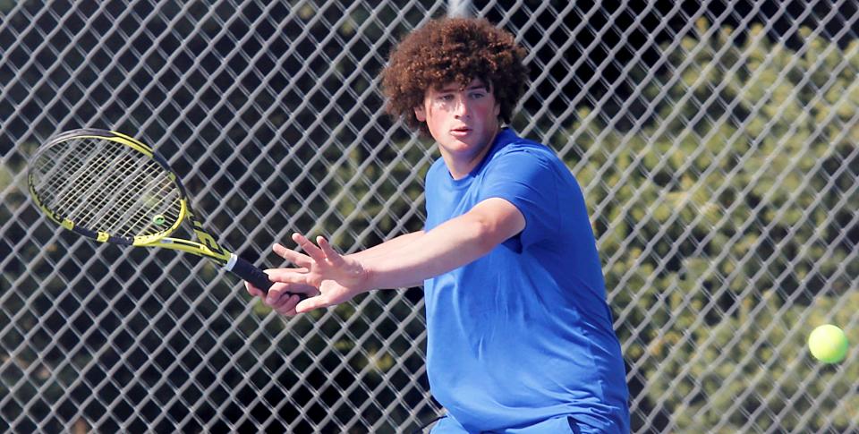 Aberdeen Central's AJ Prehn focuses on hitting a return shot in a second-flight singles match during the Eastern South Dakota Conference boys tennis tournament on Tuesday, May 9, 2023 in Mitchell.