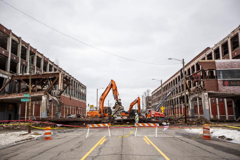 A crew tears down the overpass that collapsed at the Packard Plant in Detroit on Thursday, Jan. 24, 2019. 