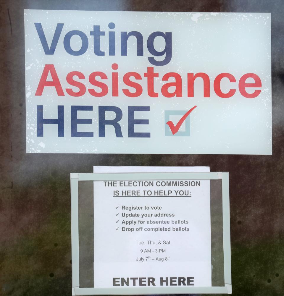 A voting assistance sign is on the doors of the library is a signal to voters where they can get voting help, which was on display during a news conference at Milwaukee Public Library Washington Park Branch in Milwaukee  on Monday, July 13, 2020. City and election officials outlined preparations for the August 11 election through the SafeVote plan, which encourages residents to exercise their vote safely from their home by requesting an absentee ballot by mail.  Mike De Sisti / Milwaukee Journal Sentinel  