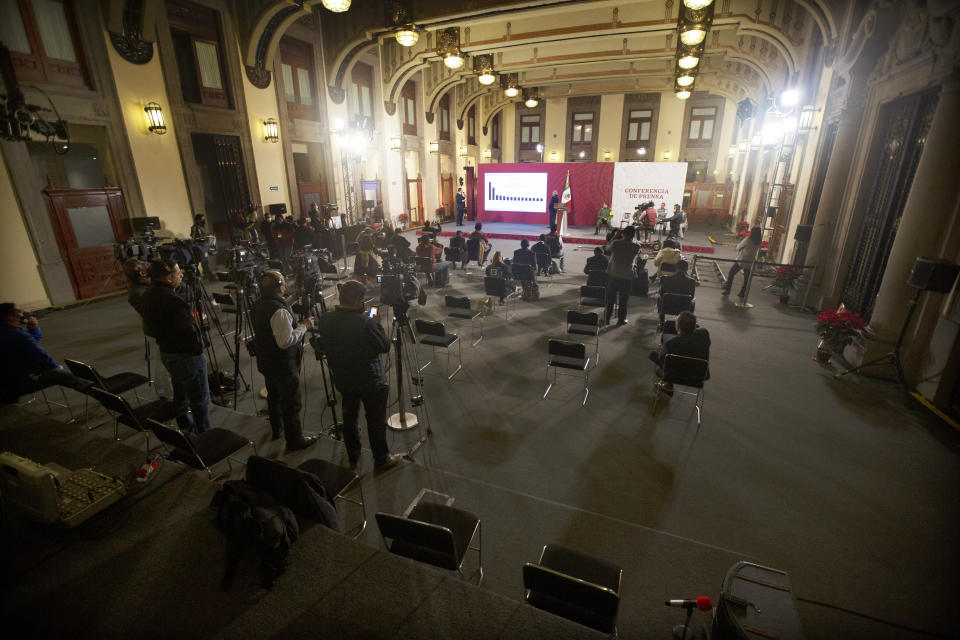 Mexican President Andres Manuel Lopez Obrador gives his regular morning press conference known as "La Mañanera" at the Palacio Nacional in Mexico City, Friday, Dec. 18, 2020. The president’s office estimates that about 10 million people watch Obrador's morning press conferences on an average per day, but that number could not be confirmed. (AP Photo/Marco Ugarte)