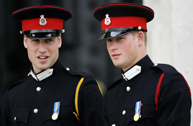 Sandhurst, UNITED KINGDOM: (FILES) This picture taken 12 April 2006 at the Royal Military Academy in Sandhurst, southern England, shows Britain's Prince Harry (R) and his brother Prince William attending the Sovereign's Parade. Prince Harry is to serve in Iraq with his regiment the Blues and Royals, the Ministry of Defence said 22 February 2007. The 22-year-old, who is third in line to the throne, is a second lieutenant in the regiment, which will deploy to Iraq in May and June for six to seven months. He is the first British royal to see active service for 25 years. AFP PHOTO FILES/CARL DE SOUZA (Photo credit should read CARL DE SOUZA/AFP via Getty Images)