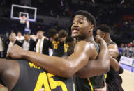 Baylor guard Jared Butler (12) smiles while huddled at midcourt with teammates after an NCAA college basketball game against Florida, Saturday, Jan. 25, 2020, in Gainesville, Fla. (AP Photo/Matt Stamey)
