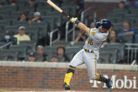Milwaukee Brewers' Kolten Wong hit a single during the ninth inning of the team's baseball game against the Atlanta Braves. Saturday, July 31, 2021, in Atlanta. (AP Photo/Hakim Wright Sr.)
