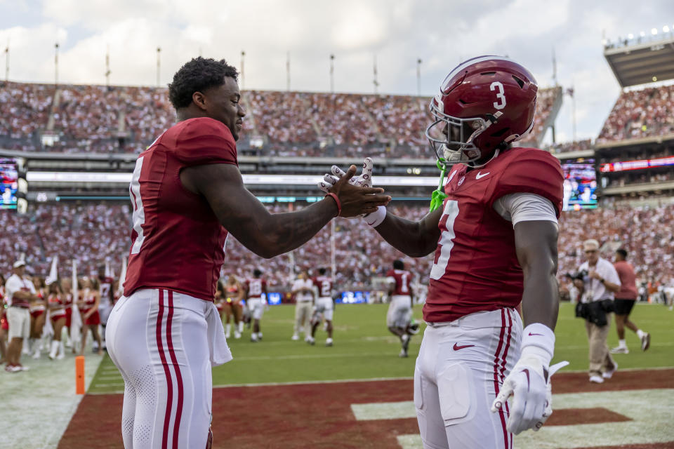 Alabama quarterback Jalen Milroe (4) and defensive back Terrion Arnold (3) shake hands before kickoff of an NCAA college football game against Texas, Saturday, Sept. 9, 2023, in Tuscaloosa, Ala. (AP Photo/Vasha Hunt)