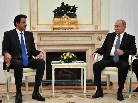 Russian President Vladimir Putin meets with Qatar Emir Sheikh Tamim bin Hamad al-Thani at the Kremlin in Moscow, Russia July 15, 2018. Yuri Kadobnov/Pool via REUTERS