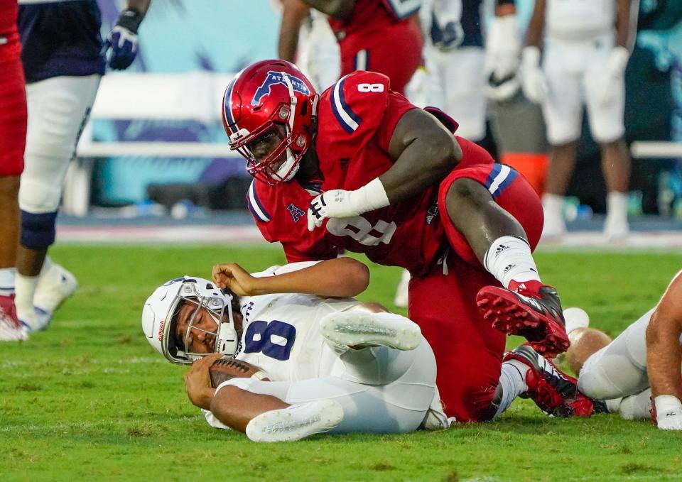Florida Atlantic defensive tackle Evan Anderson (8) sacks the quarterback during a 42-20 victory over Monmouth at FAU Stadium on Saturday, September 2, 2023, in Boca Raton, FL.