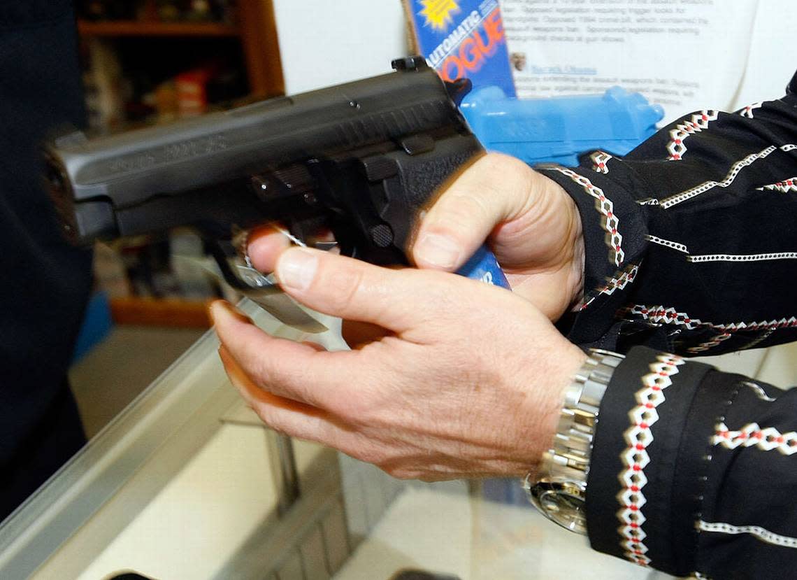 Eric Brandon of Nevada tries out a semi-automatic pistol at The Gun Store November 14, 2008 in Las Vegas, Nevada. Store manager Cliff Wilson said he’s seen a large spike in sales since Barack Obama was elected president on November 4, with customers citing fears about the president-elect’s record on firearms. The election, combined with a slumping economy, has contributed to an overall increase of 25-30 percent in gun sales at the store, Wilson said.