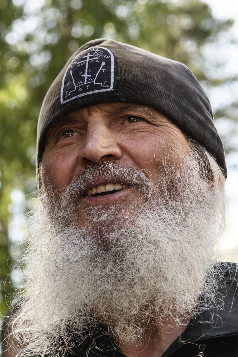 In this photo taken on Wednesday, June 17, 2020, Father Sergiy, a Russian monk who has defied the Russian Orthodox Church's leadership speaks to journalists in Russian Ural's Sredneuralsk, Russia. (AP Photo/Vladimir Podoksyonov)