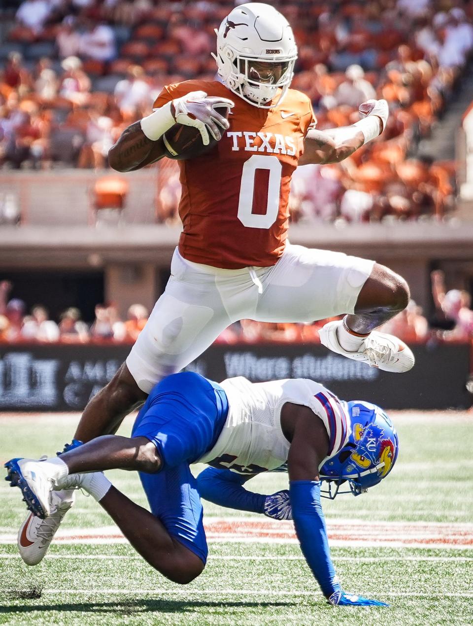 Tight end Ja'Tavion Sanders, hurdling Kansas cornerback Mello Dotson, has two 100-yard games receiving this season.