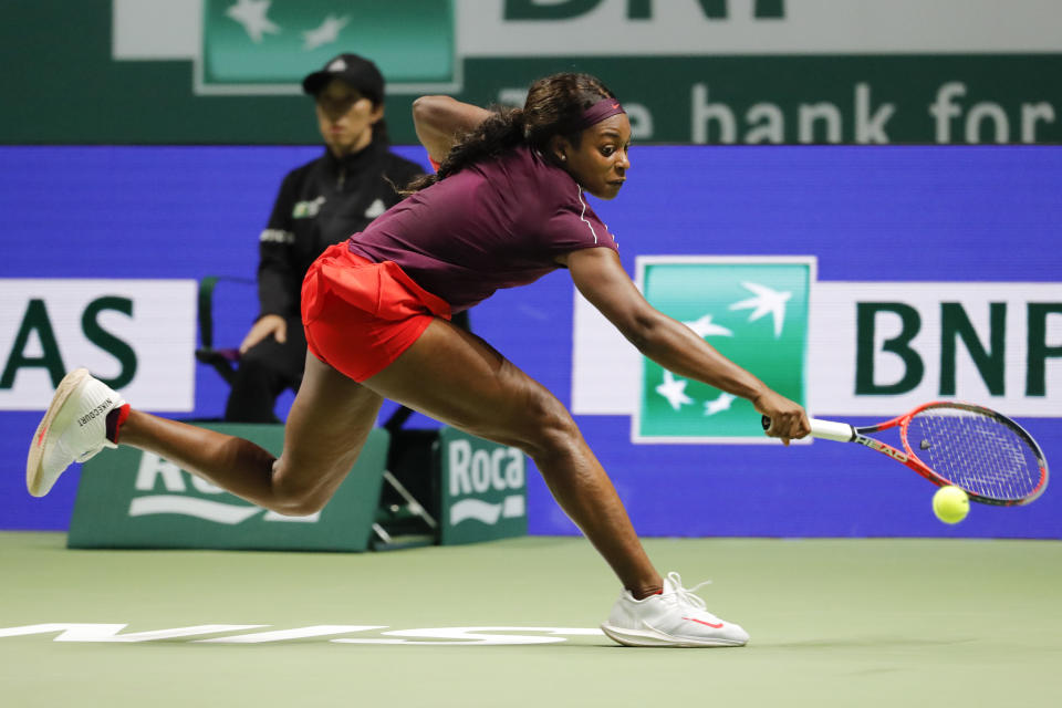 Sloane Stephens plays a return shot against Kiki Bertens during her round-robin match at the WTA Finals Singapore. (PHOTO: AP/Vincent Thian)