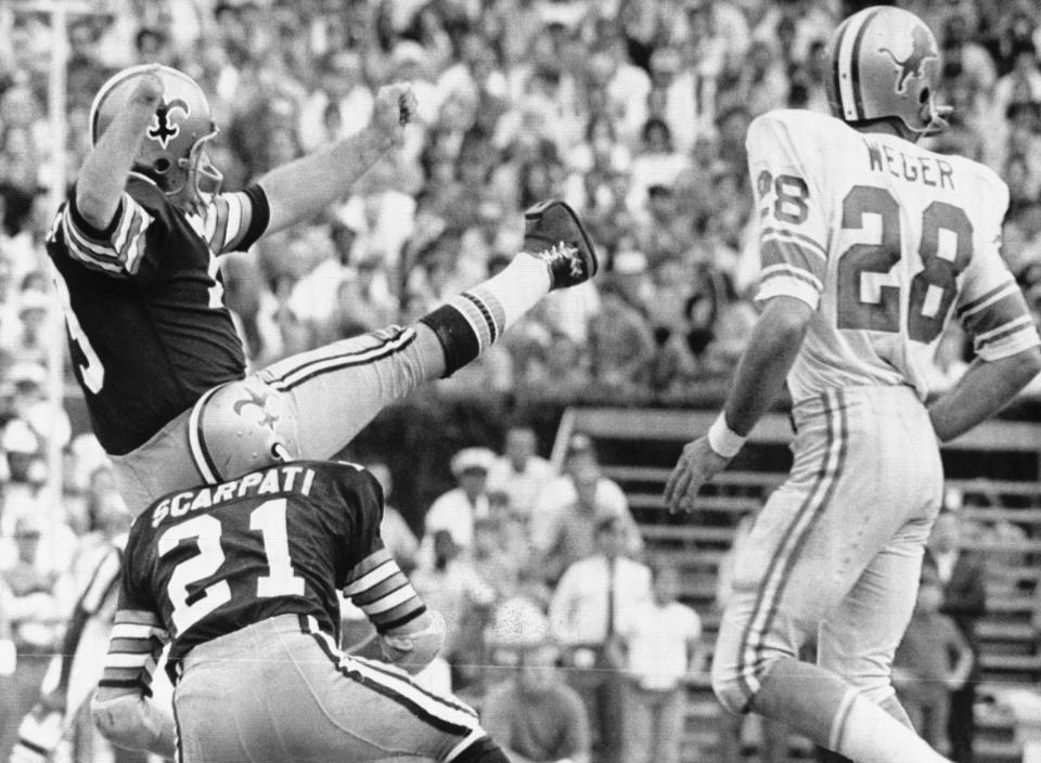 Saints kicker Tom Dempsey lets the record-setting kick fly. (Getty Images Archive)