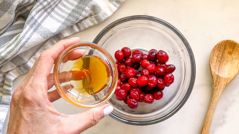 adding honey to bowl 