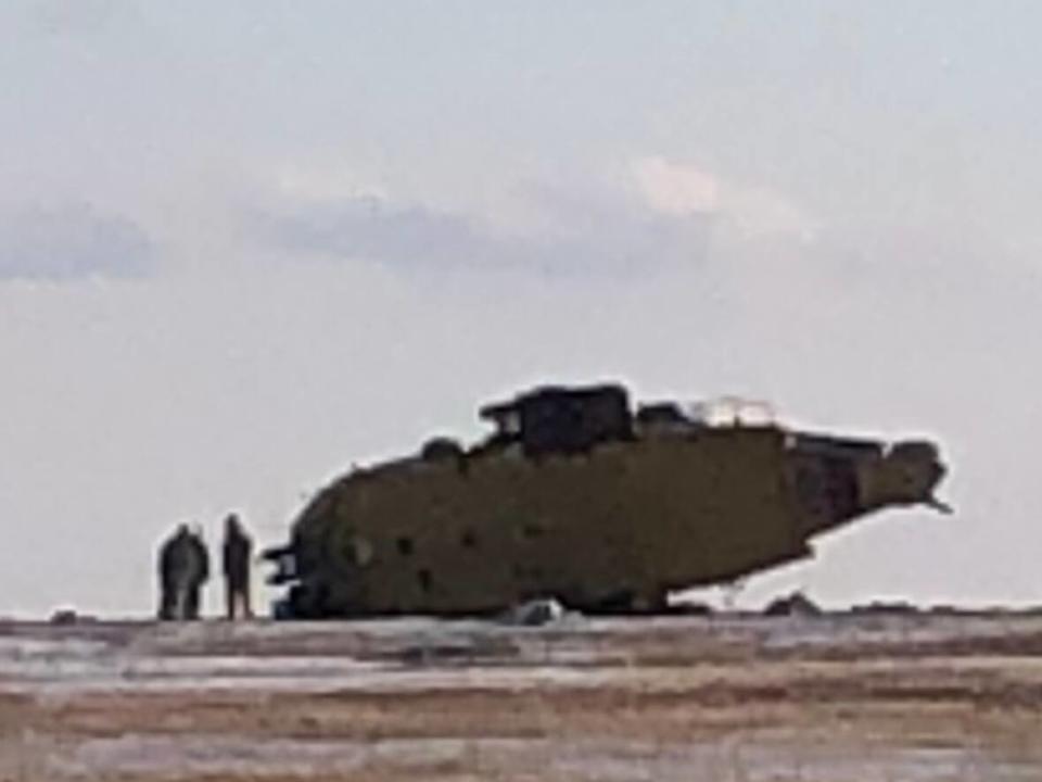 Emergency crews are pictured at the scene of a Cormorant helicopter crash at the 9 Wing Gander air base on Thursday. (David Newell/CBC - image credit)