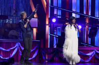 Hosts Keith Urban, left, and Mickey Guyton speak at the 56th annual Academy of Country Music Awards on Sunday, April 18, 2021, at the Grand Ole Opry in Nashville, Tenn. (AP Photo/Mark Humphrey)