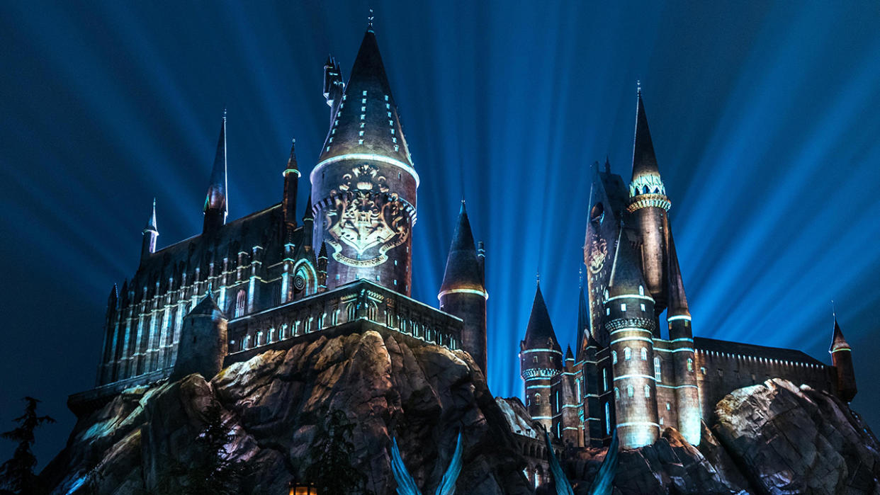  Hogwarts lit up with the nighttime lights at Universal Orlando. . 