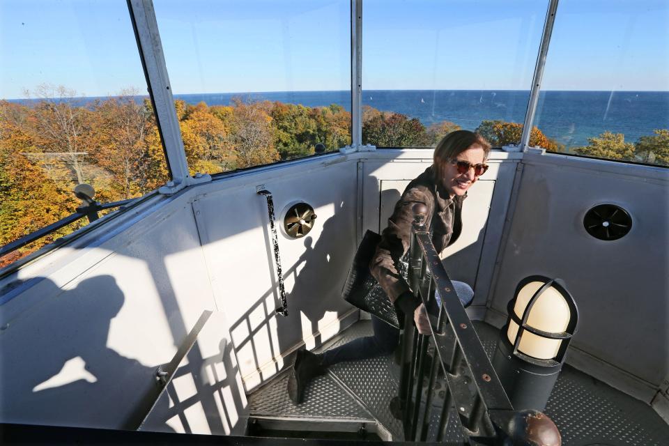 Patricia Algiers of Shorewood climbs the North Point Lighthouse tower as part of a tour on Oct. 18, 2015.