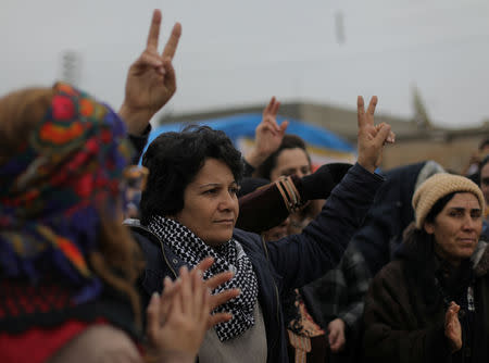 A woman gestures during a protest near the Syrian-Turkish border in Ras al-Ayn town, Syria December 20, 2018. REUTERS/Rodi Said