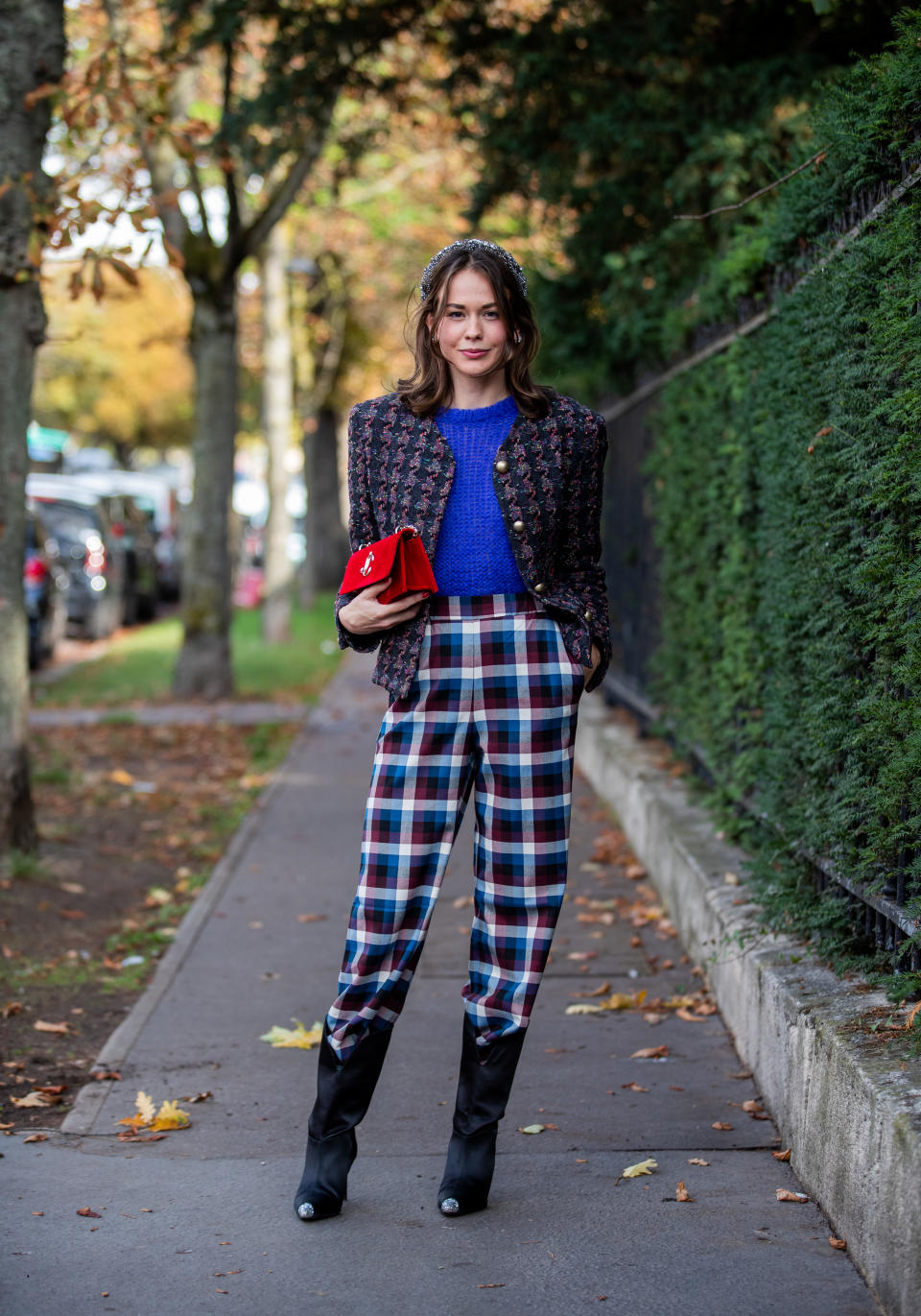 PARIS, FRANCE - OCTOBER 01: Therese Hellström seen wearing checkered pants, jacket, blue knit, boots, red bag outside Lacoste during Paris Fashion Week Womenswear Spring Summer 2020 on October 01, 2019 in Paris, France. (Photo by Christian Vierig/Getty Images)