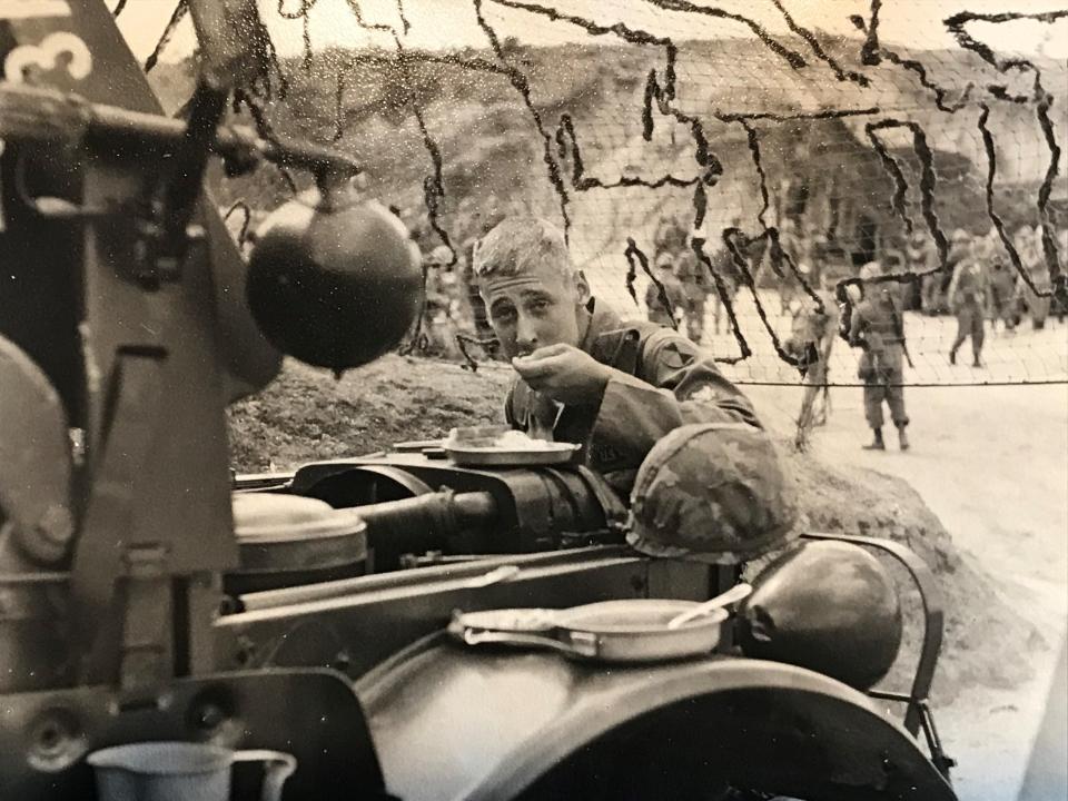 Gene Reynolds takes a meal break while serving in the Army in Korea in the 1960s.