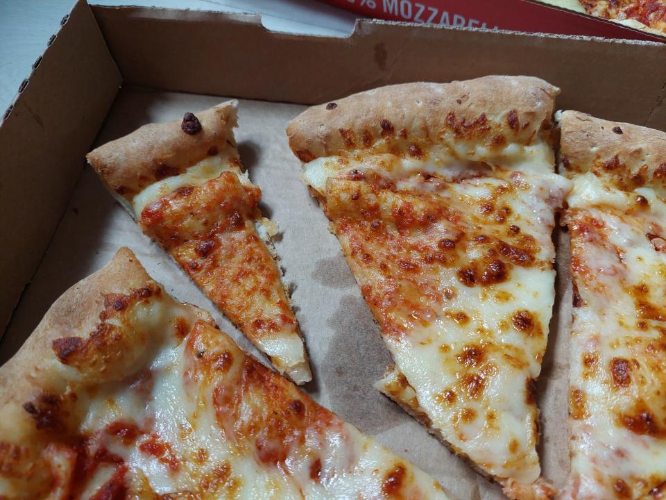 Slices of pizza from Papa John's, displayed in a box