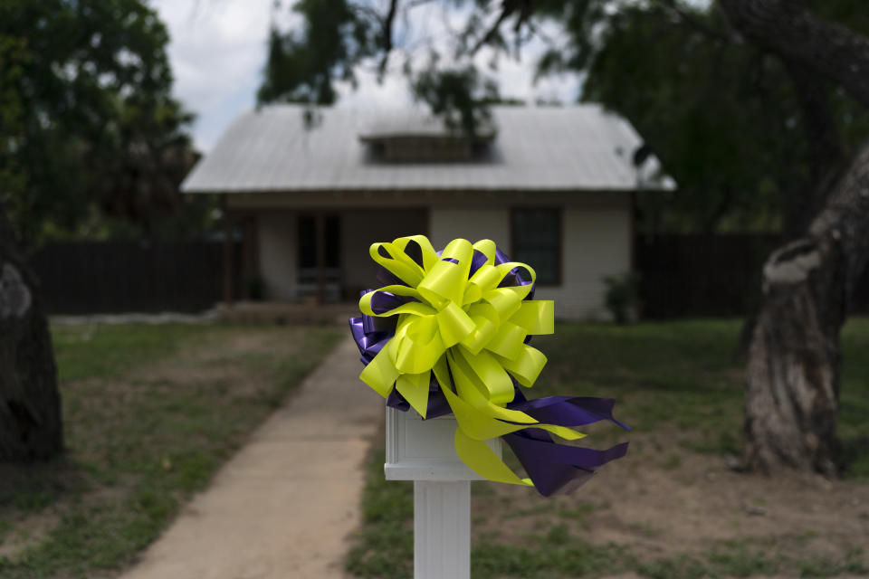 Bows adorn a mailbox outside the home of Maite Yuleana Rodriguez, one of the victims killed in last week's elementary school shooting in Uvalde, Texas, Monday, May 30, 2022. (AP Photo/Jae C. Hong)