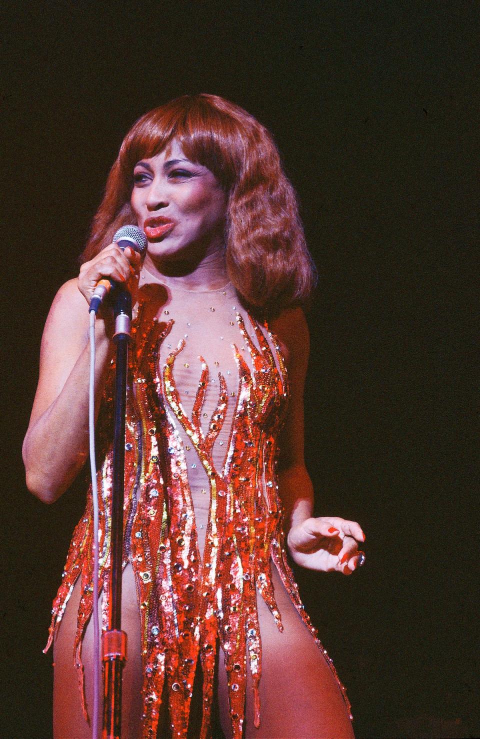 Tina Turner wearing the Flame dress designed by Bob Mackie, 1980 (Redferns)