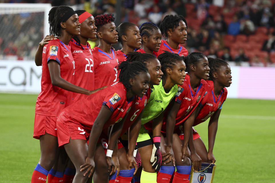 Haiti players pose for a team group before the Women's World Cup Group D soccer match between England and Haiti in Brisbane, Australia, Saturday, July 22, 2023. (AP Photo/Tertius Pickard)