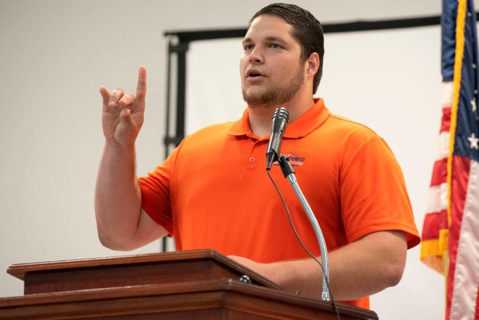 Jordan Bradford, a candidate for chancery clerk in Hancock County, uses sign language during an election forum in Waveland on Monday, July 10, 2023.