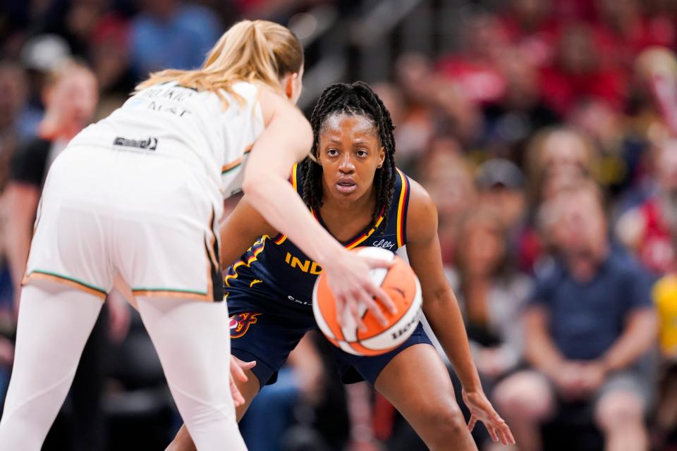 Indiana Fever guard Kelsey Mitchell (0) plays defense against New York Liberty guard Ivana DojkiÄ‡ (18) on Thursday, May 16, 2024, during the Indiana Fever home opener game against the New York Liberty at Gainbridge Fieldhouse in Indianapolis.