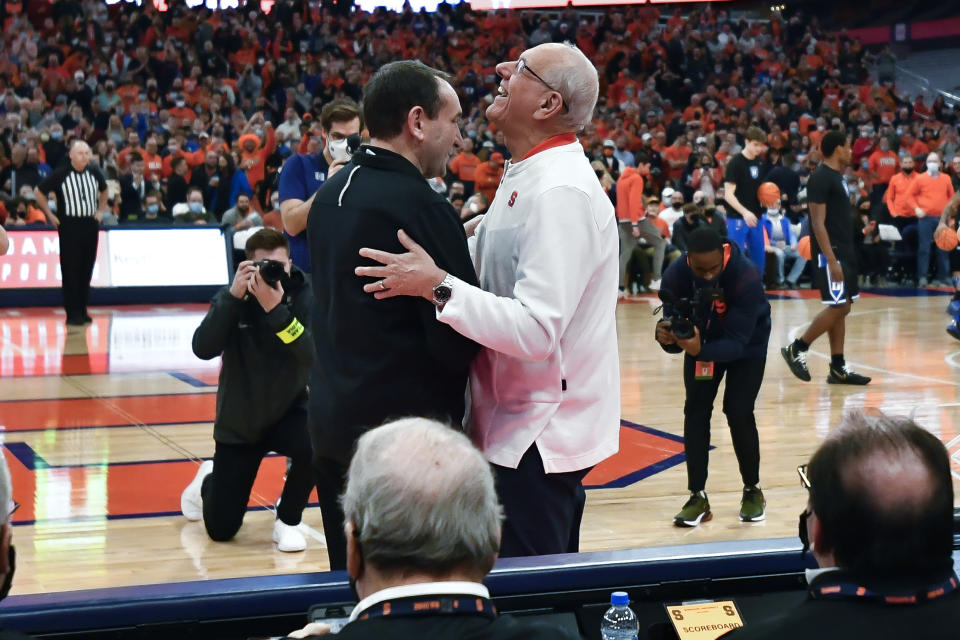 Duke coach Mike Krzyzewski, left, greets Syracuse coach Jim Boeheim before an NCAA college basketball game in Syracuse, N.Y., Saturday, Feb. 26, 2022. (AP Photo/Adrian Kraus)