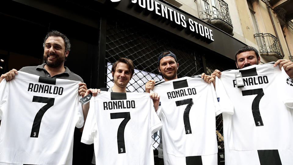 Juventus fans with their new Ronaldo jerseys. Pic: Getty