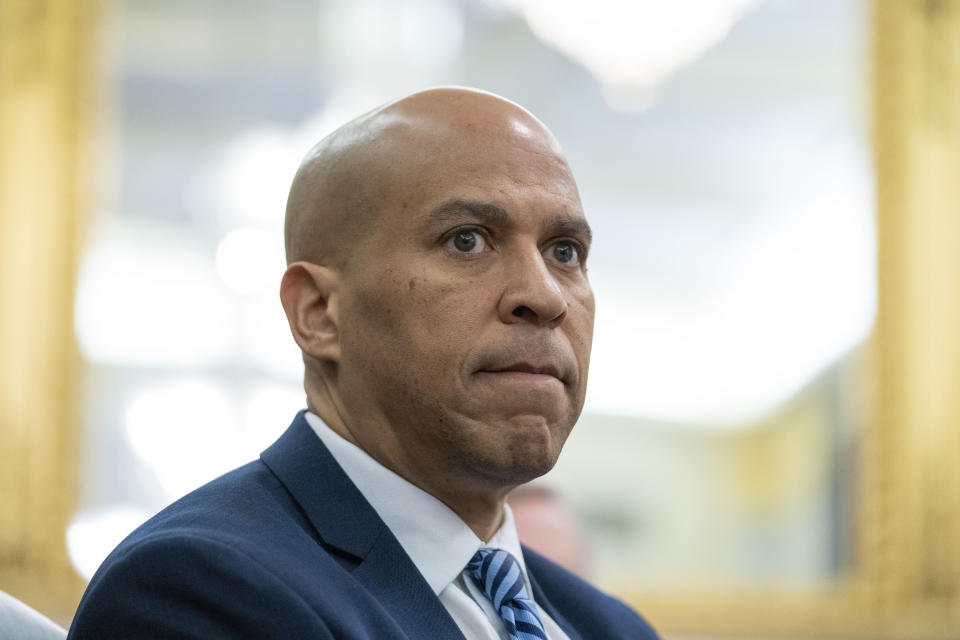 FILE - Sen. Cory Booker, D-N.J., listens during a Senate hearing on Capitol Hill, March 16, 2023 in Washington. Booker is calling on Sen. Bob Menendez to resign, saying in a statement that the federal bribery charges unveiled on Friday against his fellow New Jersey Democrat contain ”shocking allegations of corruption and specific, disturbing details of wrongdoing.” (AP Photo/Alex Brandon, File)