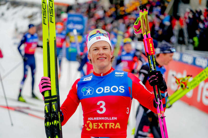 Norway's Johannes Hosflot Klaebo celebrates after wining the men's  50 kilometres cross country race. Terje Pedersen/NTB/dpa