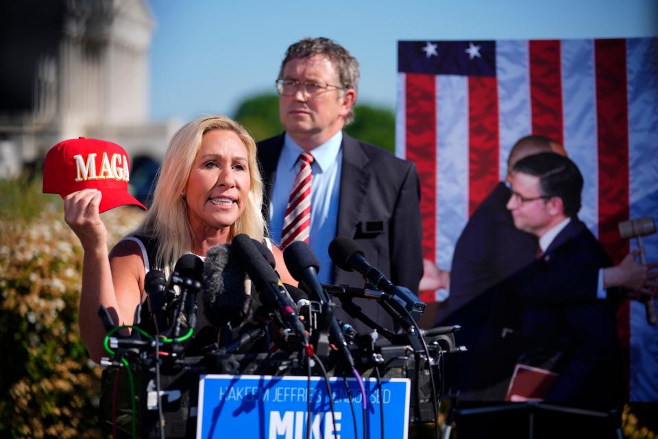 Reps. Marjorie Taylor Greene, R-Ga., and Thomas Massie, R-Ky., hold a news conference outside the U.S. Capitol on May 1, 2024, about a potential motion to vacate against House Speaker Mike Johnson.