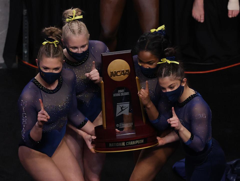 The Michigan women's gymnastics team celebrates after winning the national championship on Saturday, April 17, 2021, in Fort Worth, Texas.