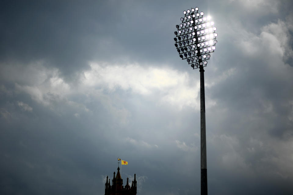 <p>TAUNTON, ENGLAND - SEPTEMBER 13: A Somerset flag flies from a nearby church as the floodlights are turned on during Day Two of the LV= Insurance County Championship match between Somerset and Lancashire at The Cooper Associates County Ground on September 13, 2021 in Taunton, England. (Photo by Harry Trump/Getty Images)</p>
