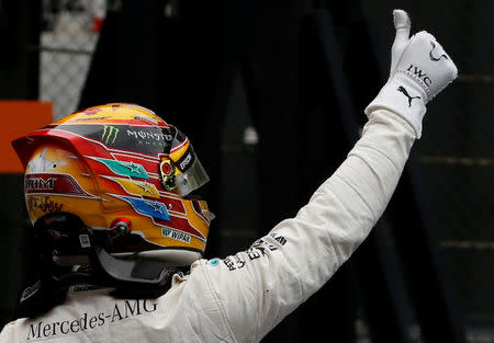 Formula One F1 - Japanese Grand Prix 2017 - Suzuka Circuit, Japan - October 7, 2017. Mercedes' Lewis Hamilton of Britain celebrates after getting pole position in qualifying. REUTERS/Toru Hanai