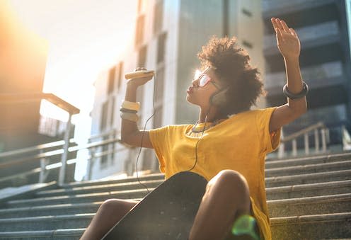 <span class="caption">The music we listen to can have a profound impact on our mood. </span> <span class="attribution"><a class="link " href="https://www.shutterstock.com/image-photo/cool-skater-girl-dancing-street-508069501" rel="nofollow noopener" target="_blank" data-ylk="slk:Merla/Shutterstock;elm:context_link;itc:0;sec:content-canvas">Merla/Shutterstock</a></span>