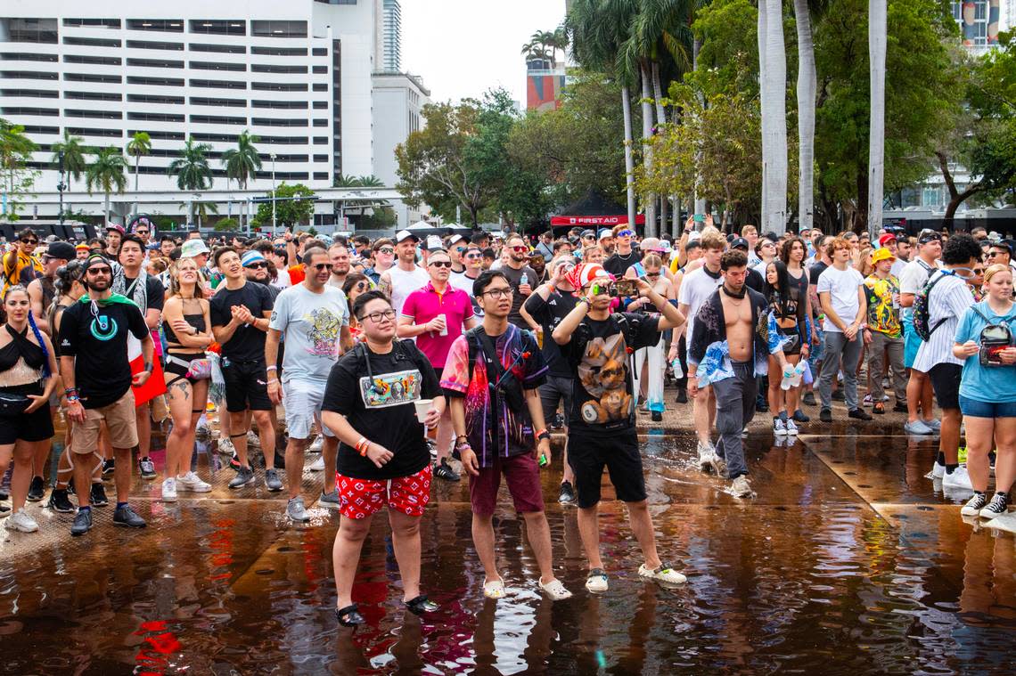 Festival goers stand in a puddle during Day 2 of Ultra 2024 at Bayfront Park in Downtown Miami on Saturday, March 23, 2024.