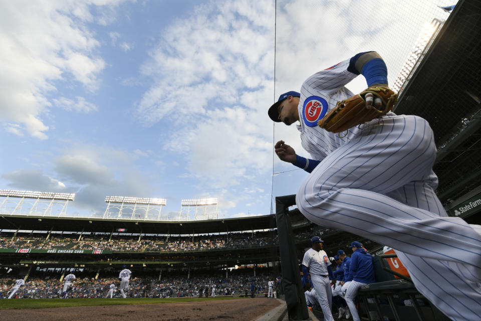 Chicago Cubs' Javier Baez runs onto the field before a baseball game against the Cleveland Indians Tuesday, June 22, 2021, at Wrigley Field in Chicago. (AP Photo/Paul Beaty)