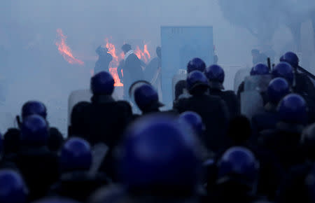 Police use tear gas to disperse crowds as people march to protest against President Abdelaziz Bouteflika's plan to seek a fifth term in Algiers, Algeria, February 22, 2019. REUTERS/Ramzi Boudina