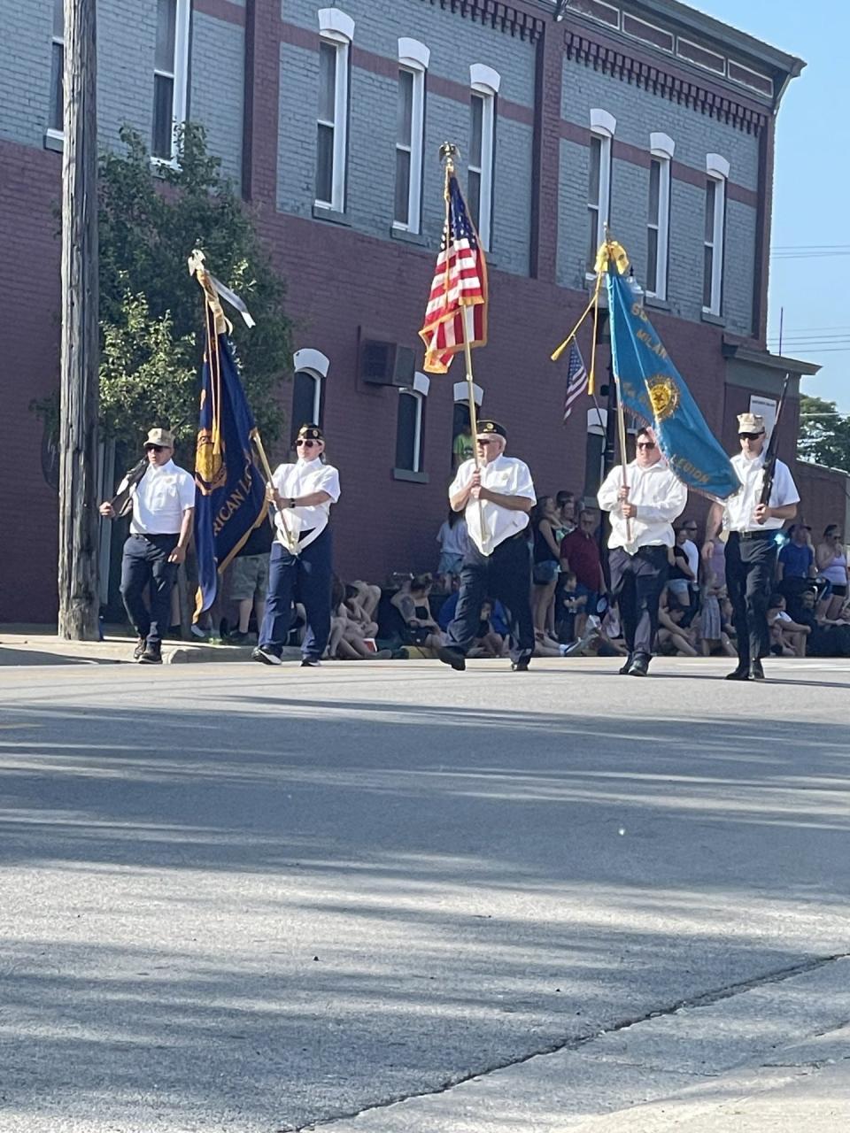Angela Jaworski (second from left) carried the American Legion flag in this year's Memorial Day parade. Jaworski is the commander of American Legion Post 268 in Milan.