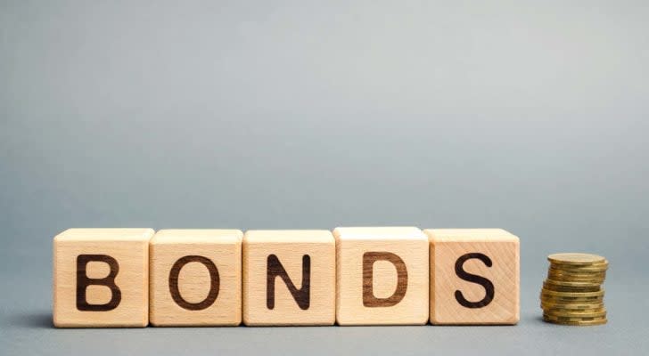 Wooden blocks with the word Bonds and coins.